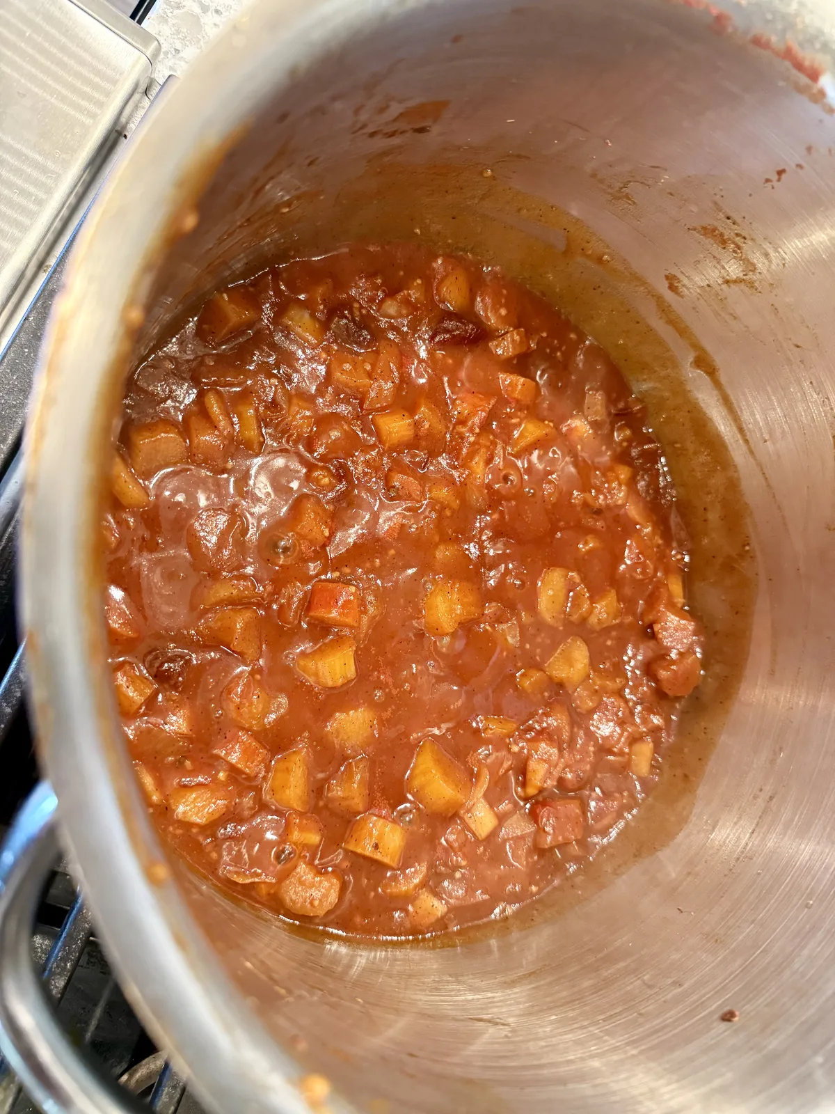 Smoky rhubarb BBQ sauce simmering in a pan at Ravenswood Gardens